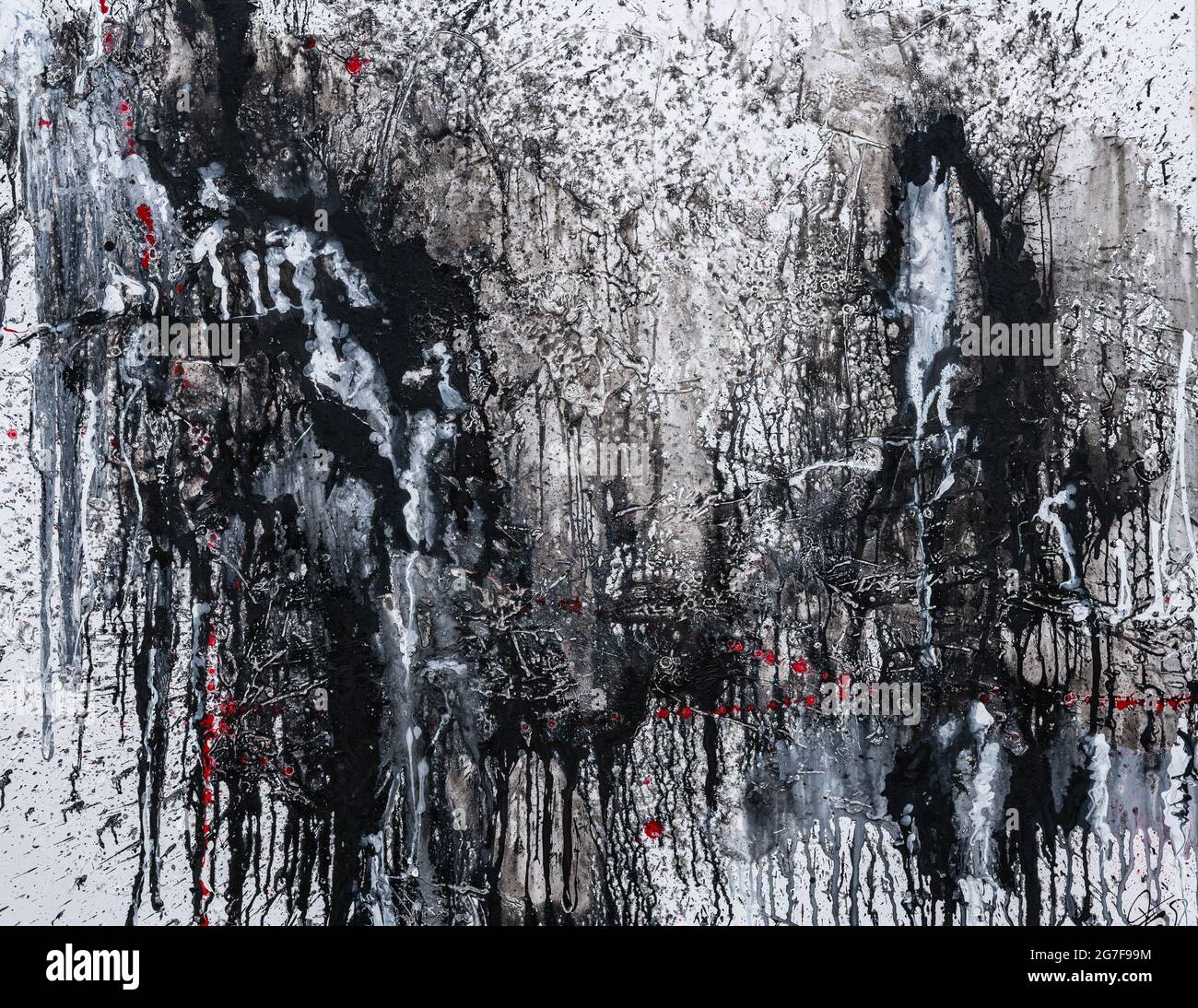 Closeup image of a textured white wall with aggressive black and red ...