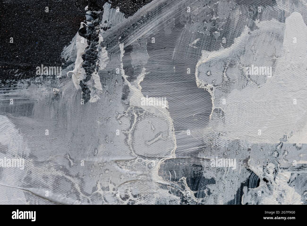 Closeup image of a textured wall painted with blended white and black ...