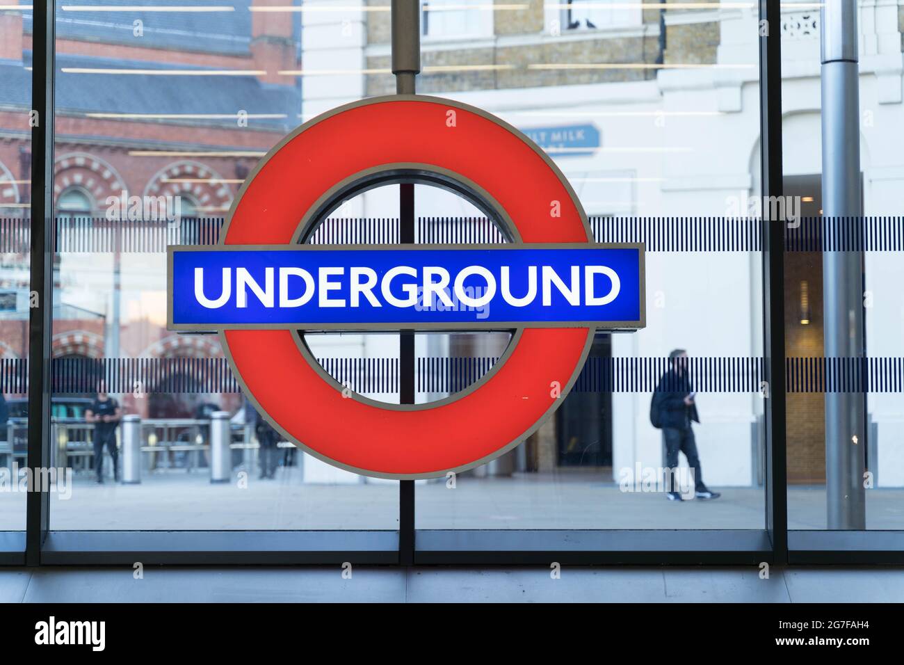 London underground sign, red circle with UNDERGROUND written in white