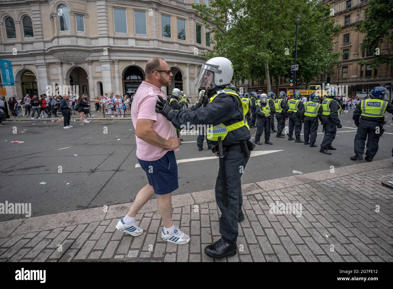 Euro 2020: Disorderly behaviour as thousands of football fans crowd near Trafalgar Square ahead of England vs Italy match finals. London, UK. Stock Photo