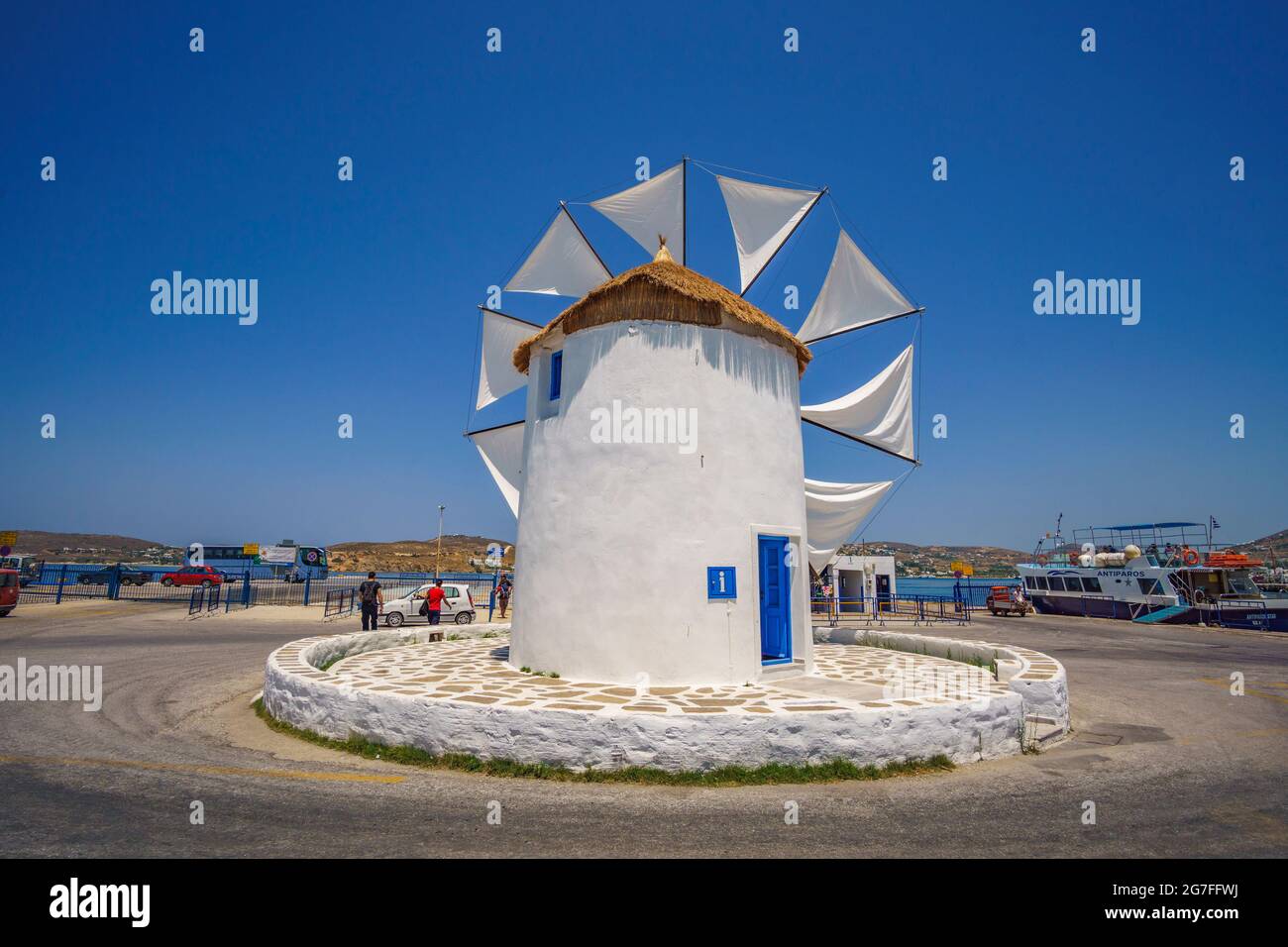 PAROS, CYCLADES, GREECE - JUNE 2017: Traditional cycladic windmill against a deep blue sky in a beautiful summer day on Paros island, Cyclades, Greece Stock Photo