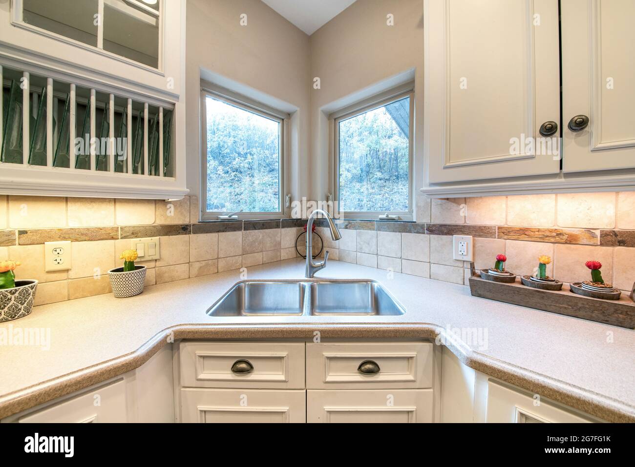 Corner vanity sink inside a kitchen with granite top Stock Photo Alamy