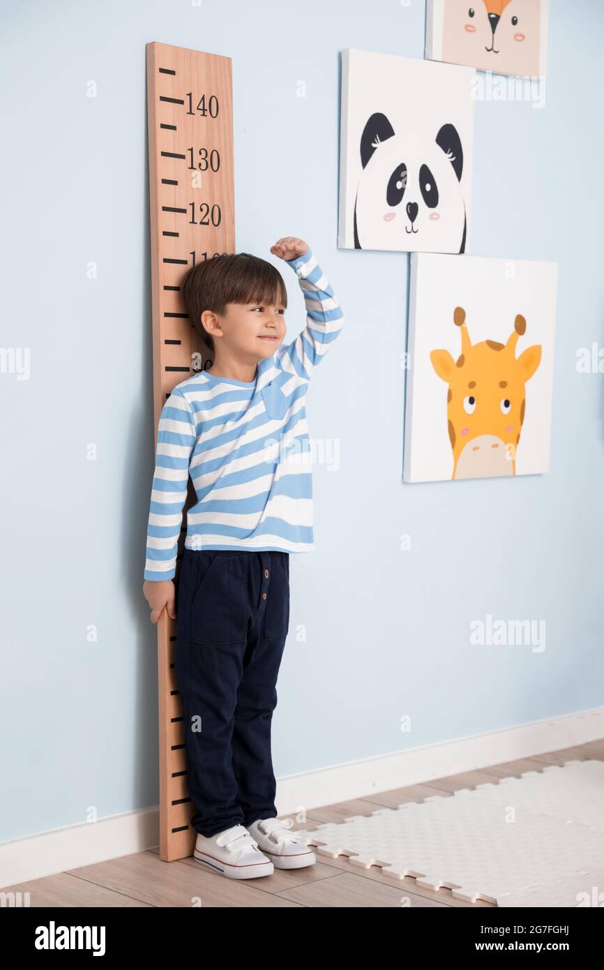 Little boy measuring height at home Stock Photo Alamy