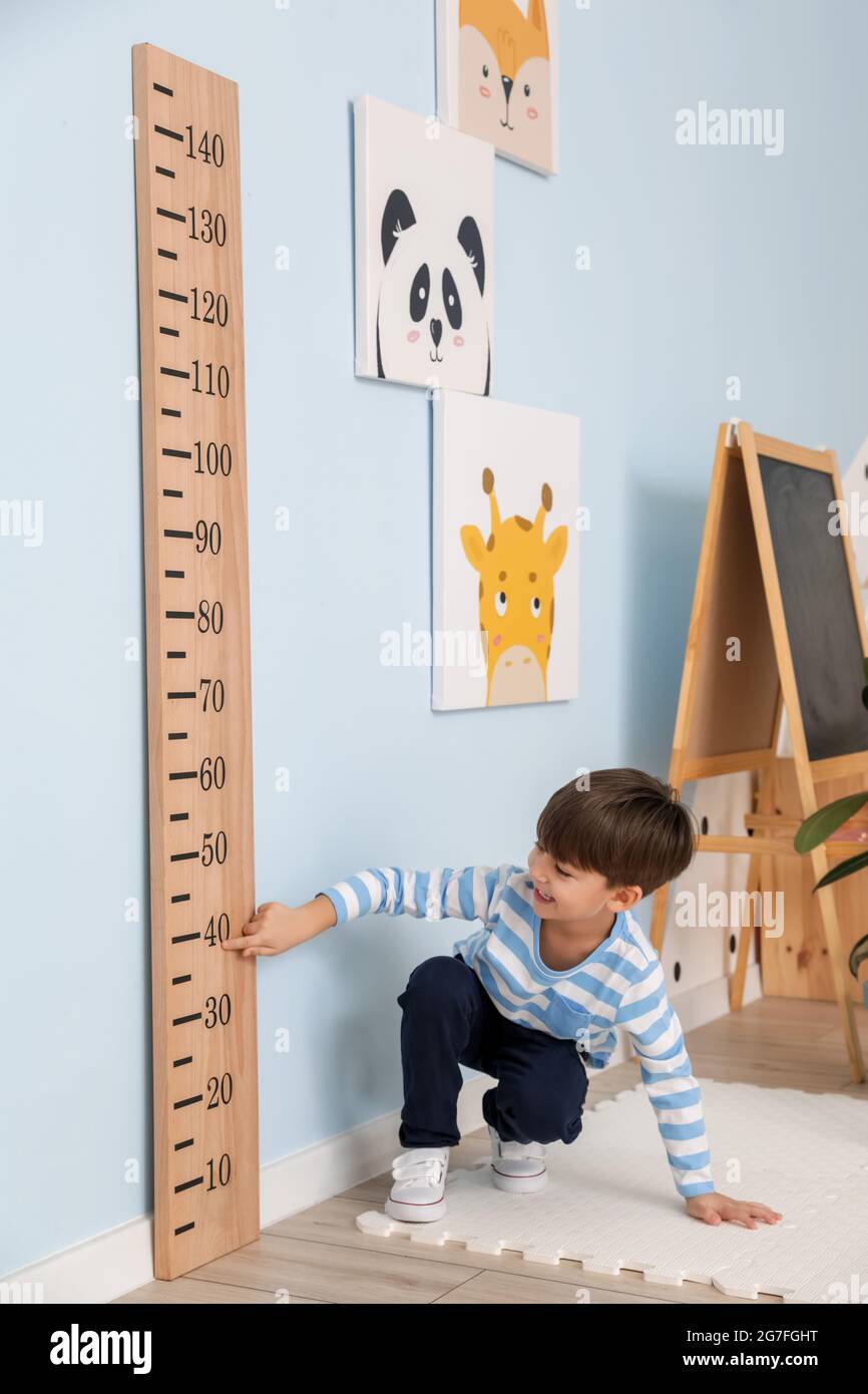 Little boy measuring height at home Stock Photo Alamy