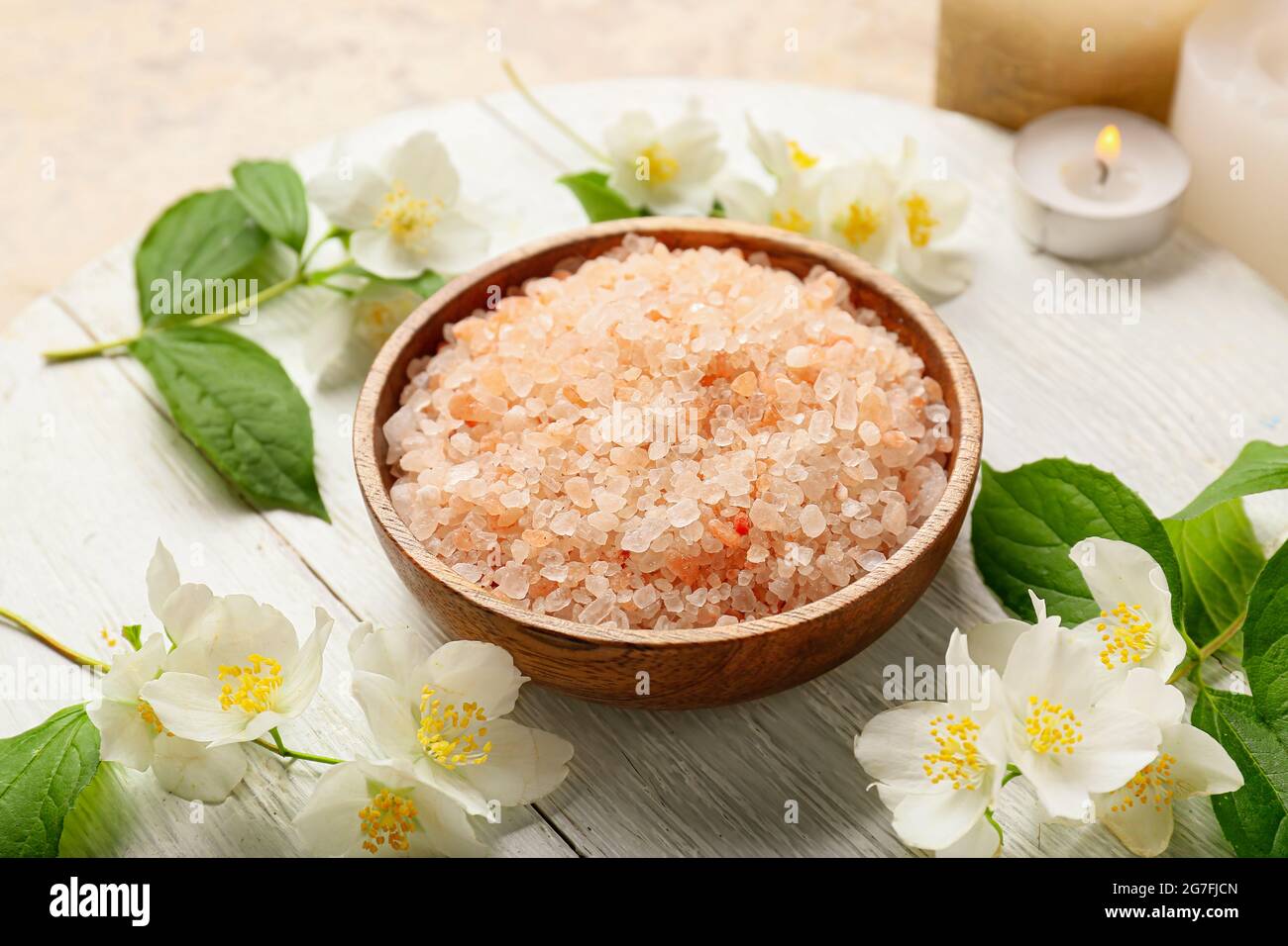 Tray with sea salt and jasmine flowers on table, closeup Stock Photo