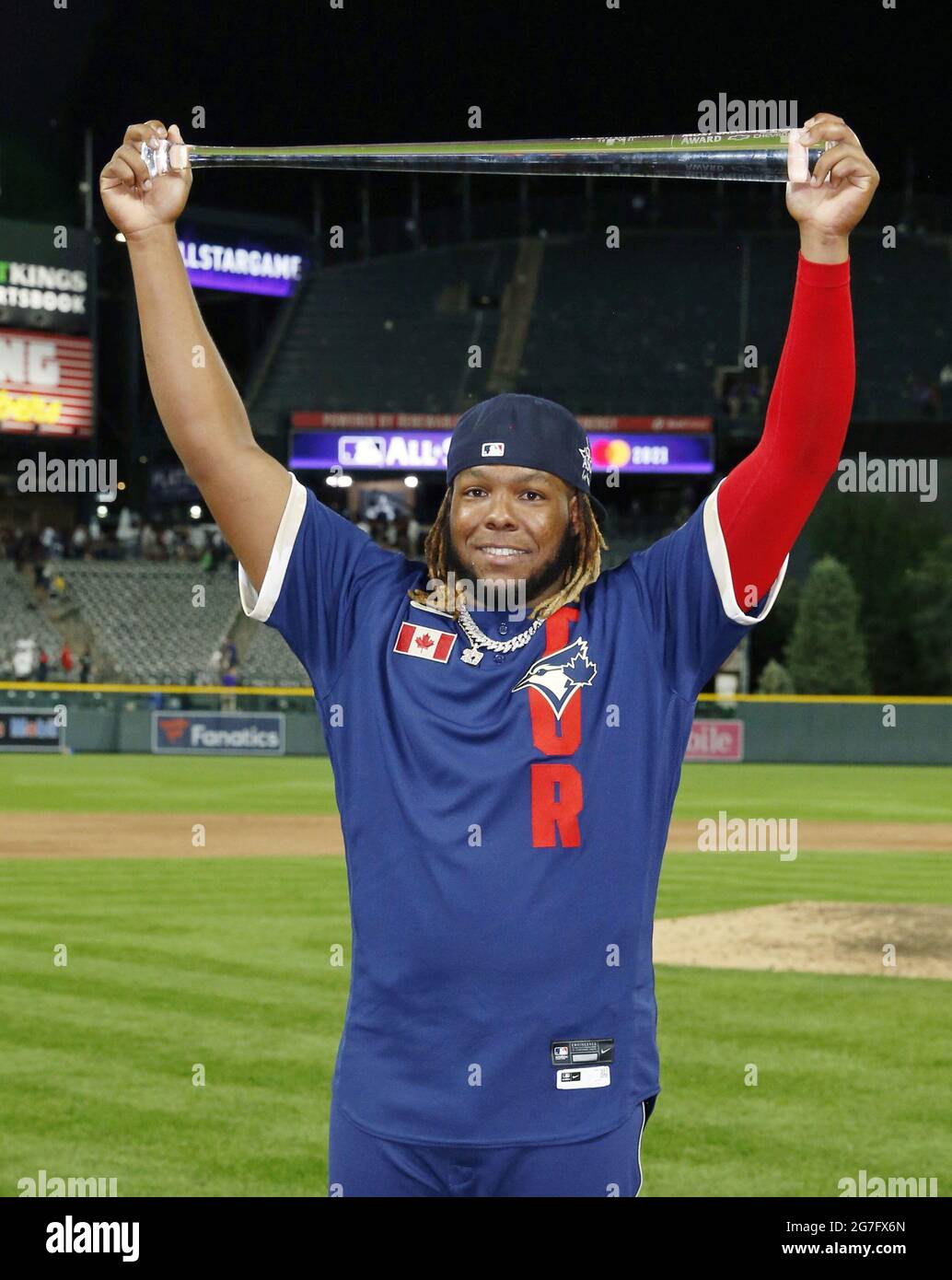 Denver, United States. 13th July, 2021. Toronto Blue Jays first baseman  Vladimir Guerrero Jr. holds the trophy after being named the MVP of the  2021 MLB All-Star Game at Coors Field in