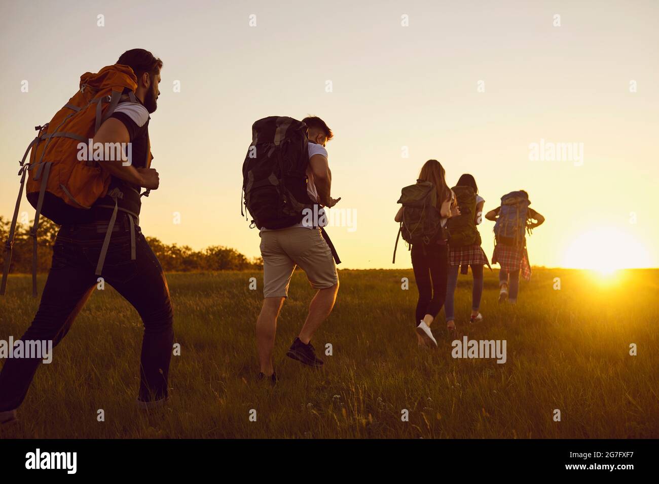 Group hikers walking sunset hi-res stock photography and images - Alamy