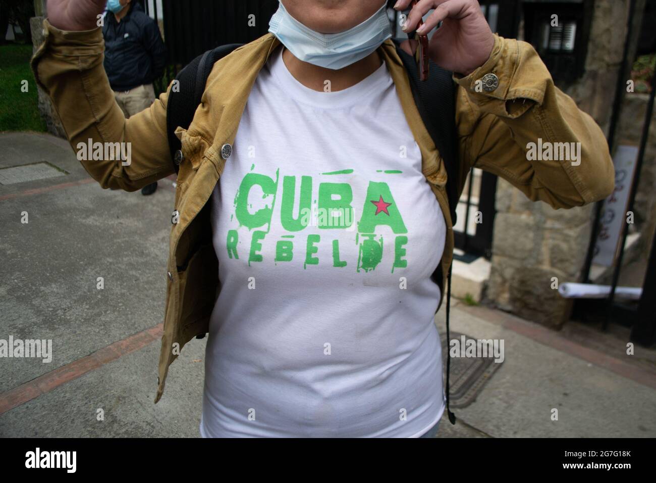 Bogota, Colombia on July 13, 2021, A Cuban resident has a shirt that reads 'Rebel Cuba' as Cuban residents residing in Colombia that protest against the president Miguel Diaz-Cannel protest in Bogota, Colombia on July 13, 2021 after anti-government protest raised in Cuba ended in unrest and violence last sunday July 13 after president Cannel urged supporters to confront protests. Stock Photo