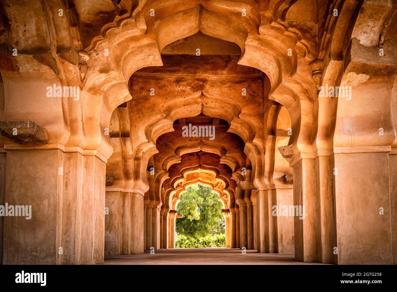 Lotus mahal temple of Zanana Enclosure at ancient town Hampi. Group of ruins monuments at Hampi was the centre of the Hindu Vijayanagara Empire, Hampi Stock Photo
