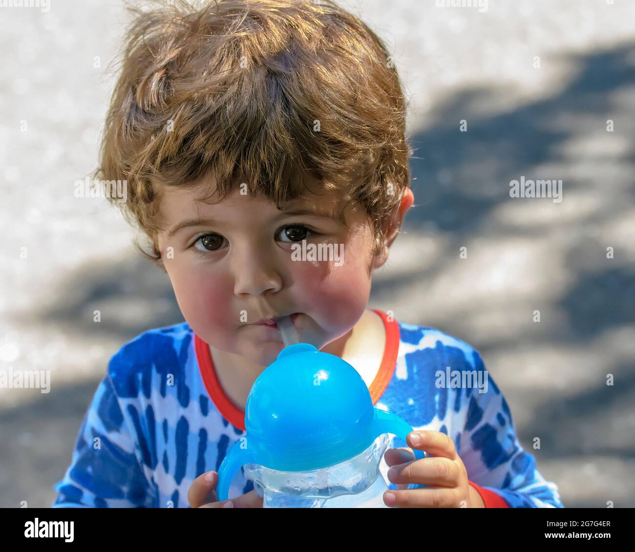 Cute toddler boy drinking water Stock Photo Alamy