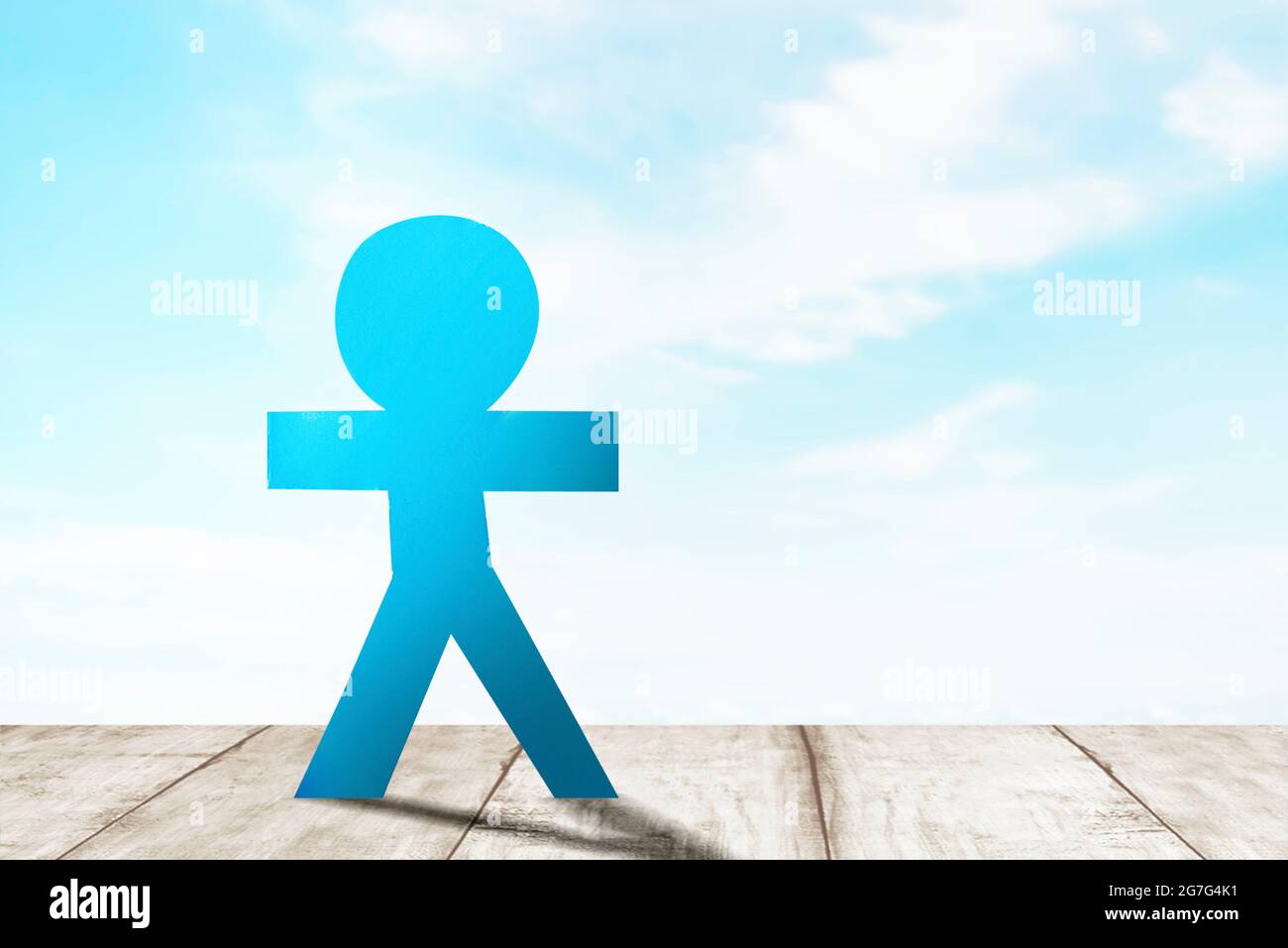 Blue people paper standing with a blue sky background. World Population Day concept Stock Photo