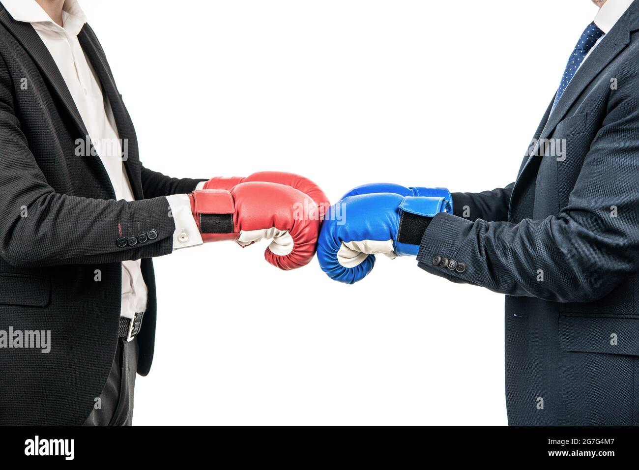 Businessmen or politicians cropped view in suits wear boxing gloves ready to fight, opposition Stock Photo