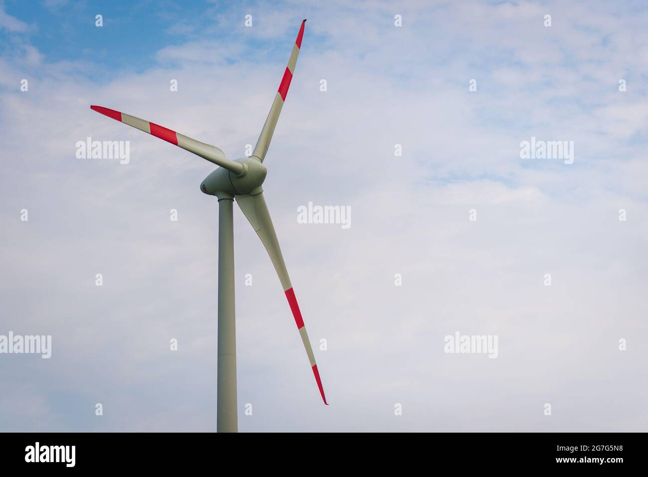 Single windmill generating electricity against blue sky.Beautiful wind ...