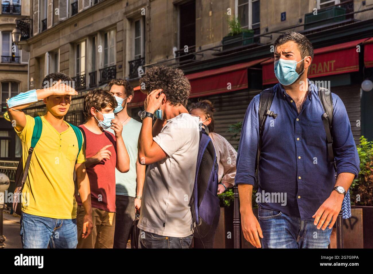Group of tourists looking in different directions - Paris, France. Stock Photo