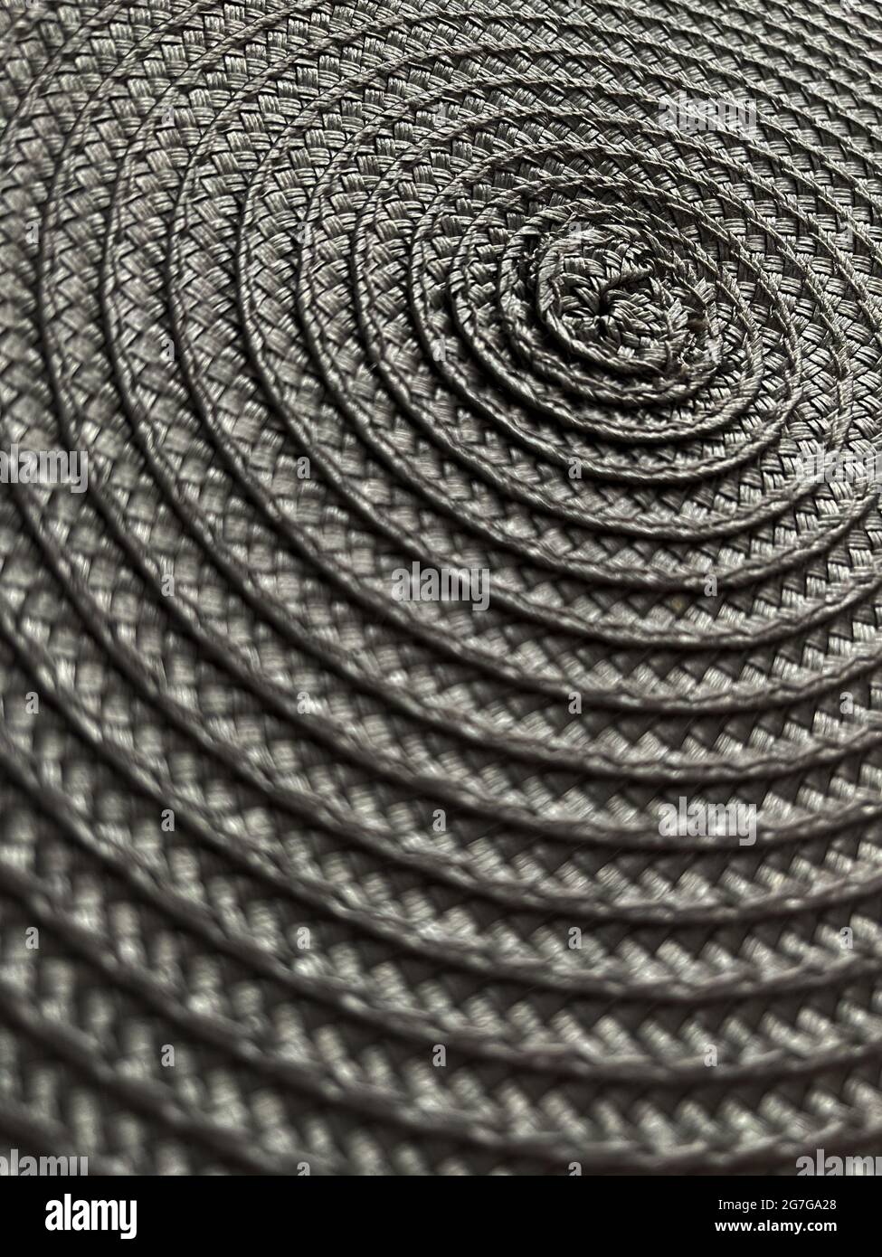 Abstract backdrop grey colour. Backdrop. Circular wicker texture.  Stock Photo