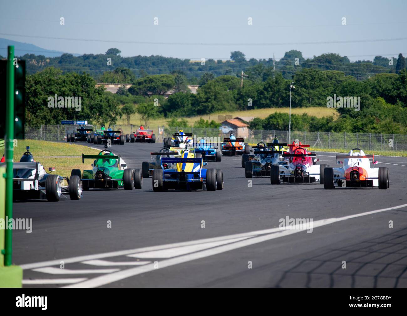 Vallelunga June 13 2021, Fx series racing. Formula cars group action rear view after race start on asphalt track circuit Stock Photo