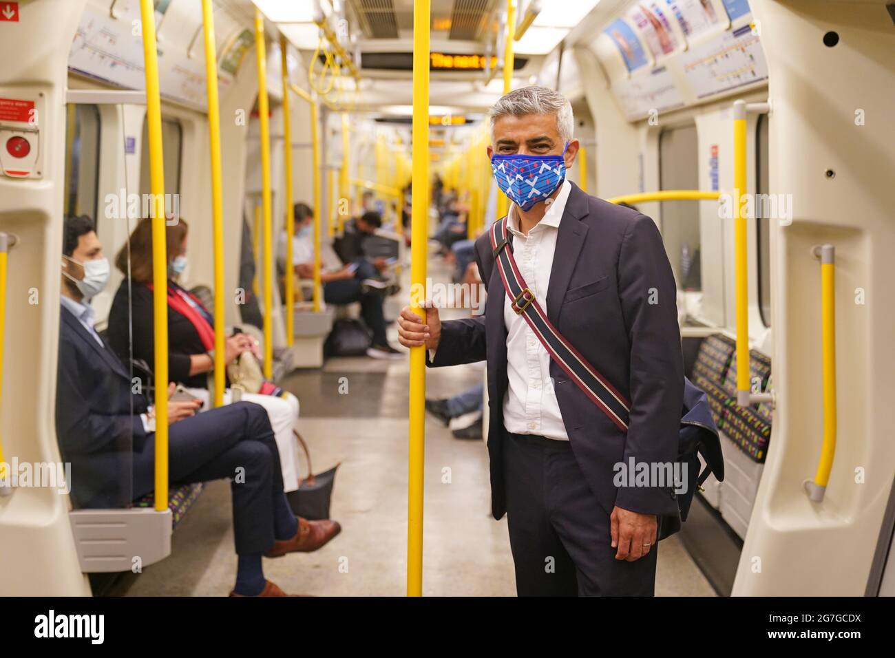 Mayor of London Sadiq Khan wears a mask as he rides on a Circle Line train on the Underground to visit the London Transport Museum. Picture date: Wednesday July 14, 2021. Stock Photo