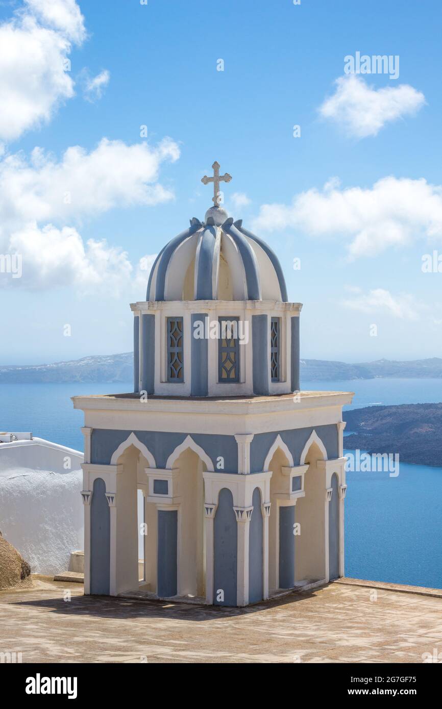 Greek Church Dome, with the Aegean sea in the background taken on the island of Santorini, Greece. Vertical orientation and no people Stock Photo