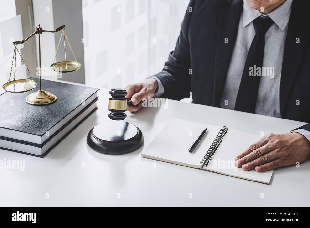 Judge gavel with Justice lawyers, Counselor in suit or lawyer working  with contract papers on a documents in courtroom, Legal law, advice and justice Stock Photo