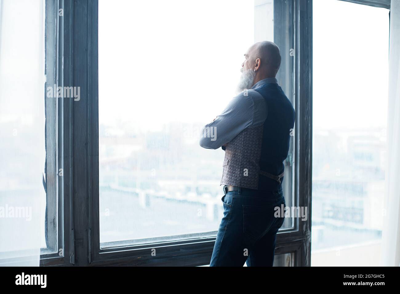 business man standing near the panoramic window Stock Photo - Alamy