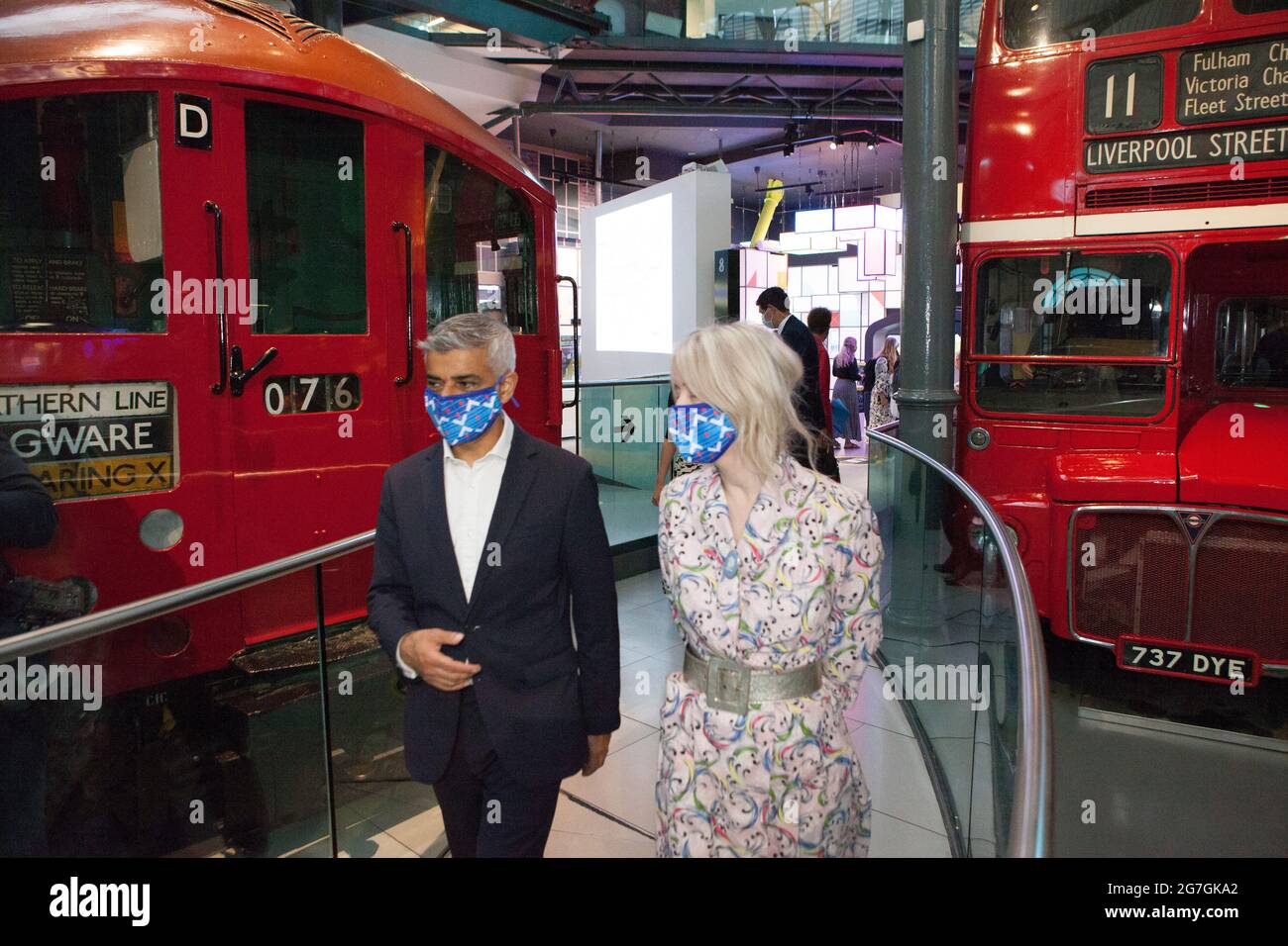 London, UK, 14 July 2021: London Mayor Sadiq Khan visited Covent Garden and the London Transport Museum this morning to launch his #LetsDoLondon campaign. The aim is to encourage tourists to visit central London. As he and Transport for London are making masks compulsory on London Underground it is hoped that tourists can visit safely despite rising coronavirus numbers. At the museum he got to sit in the driver's seat of a bus, which honours his father's job as a bus driver. With him were Justine Simons (Deputy Mayor for Culture and the Creative Industries) and Sam Mullins (Director of the Lon Stock Photo