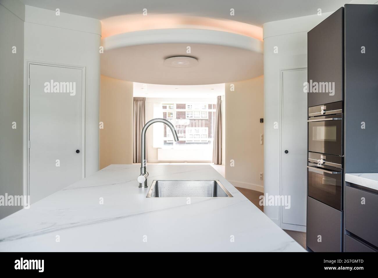Stylish kitchen island in a spacious kitchen Stock Photo