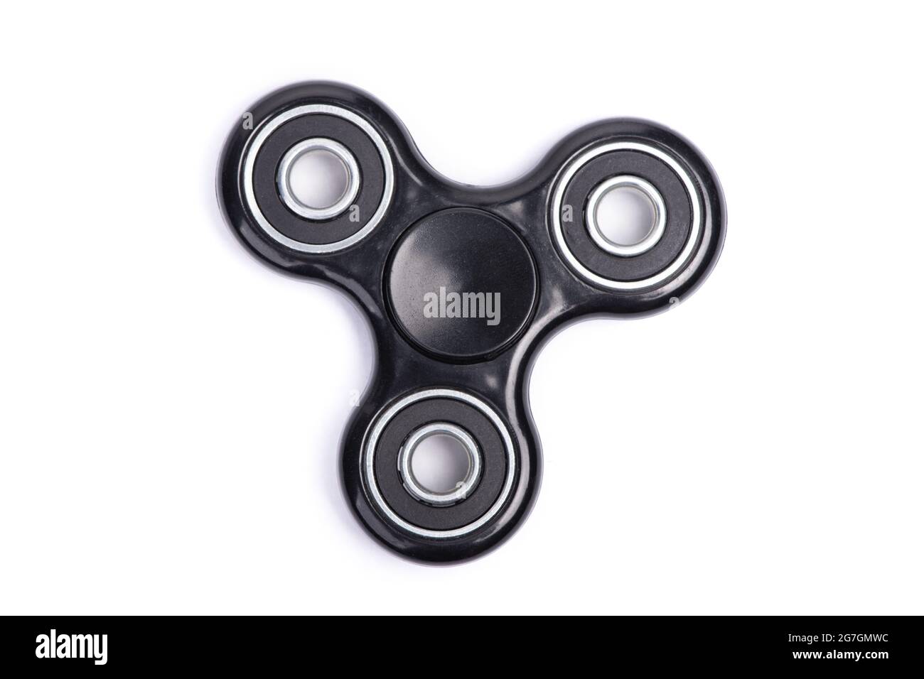 Close-up of black fidget spinner isolated over white background Stock Photo