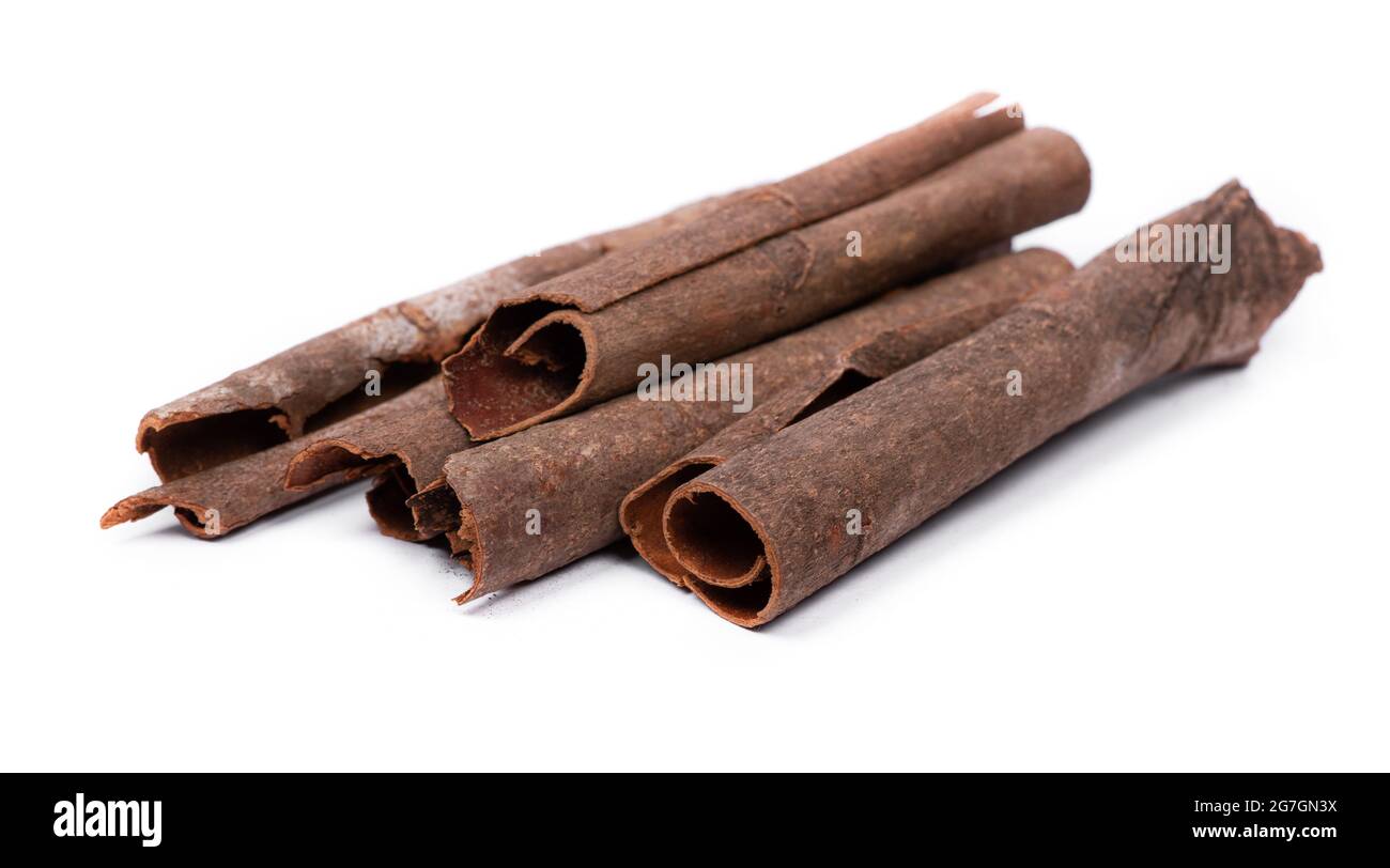 Original pieces of cinnamon sticks isolated on white background Stock Photo