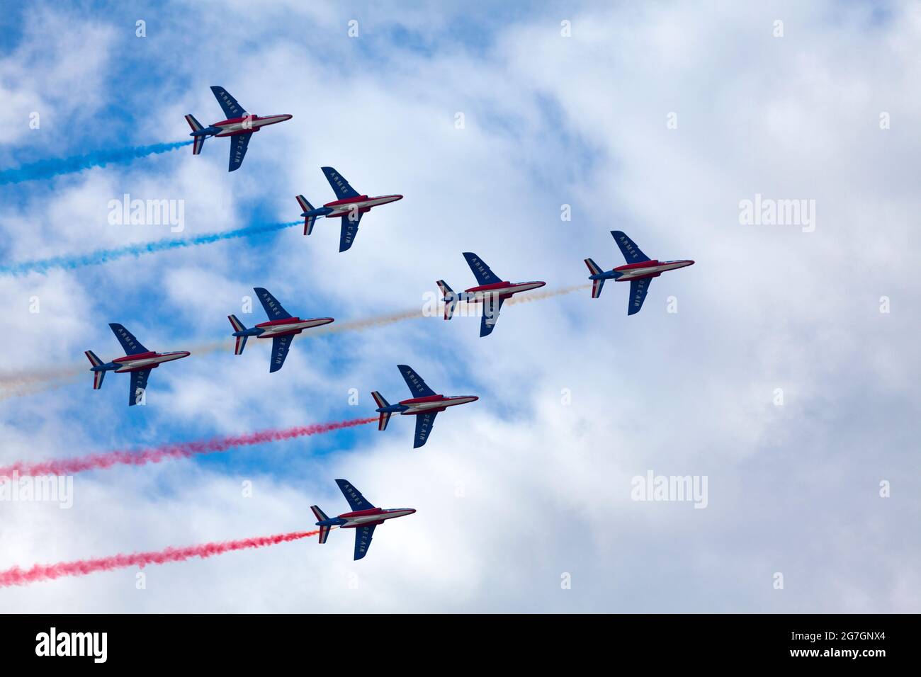 Paris, France - July 14 2021: The French Air Patrol (French: Patrouille de France) performing a demonstration to celebrate the Bastille Day. Stock Photo