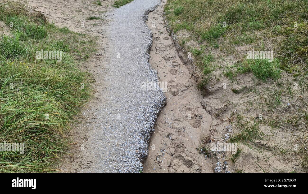 footpath partially washed away by heavy rain, Netherlands Stock Photo