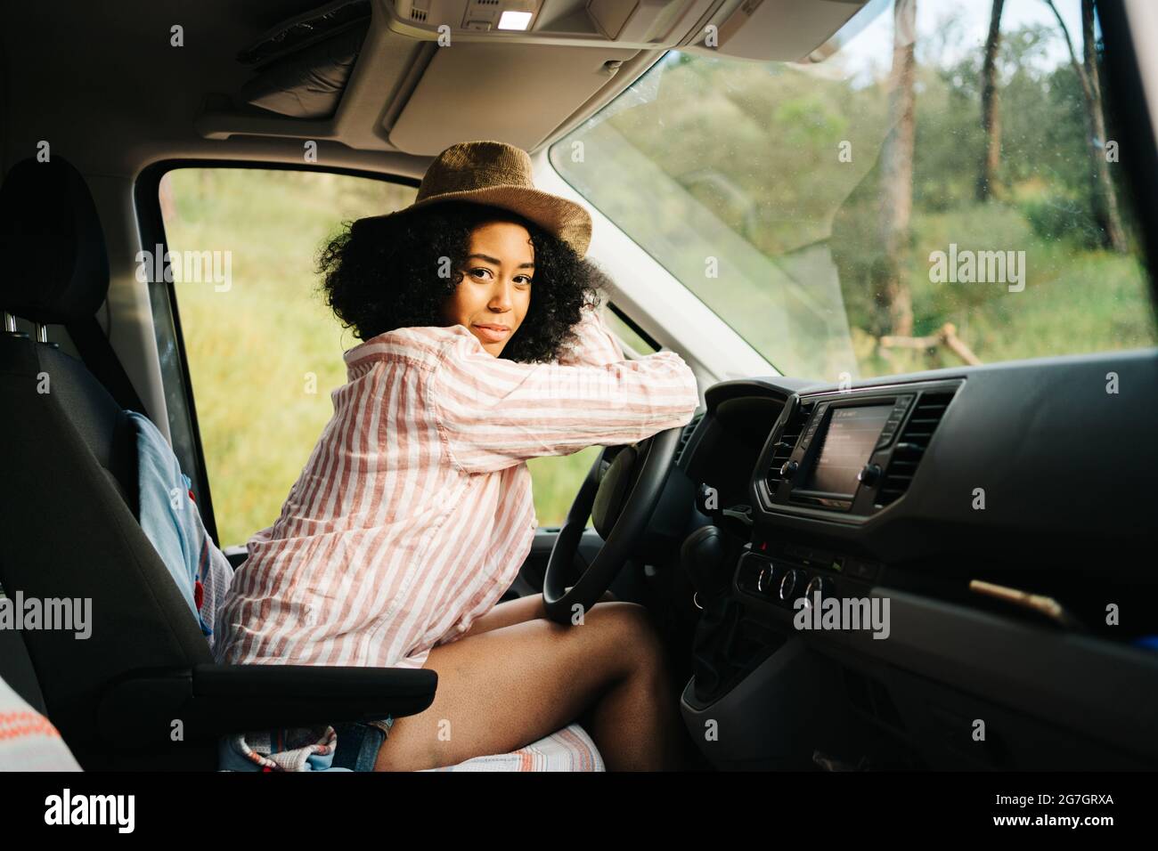 African woman sitting alone side view hi-res stock photography and ...