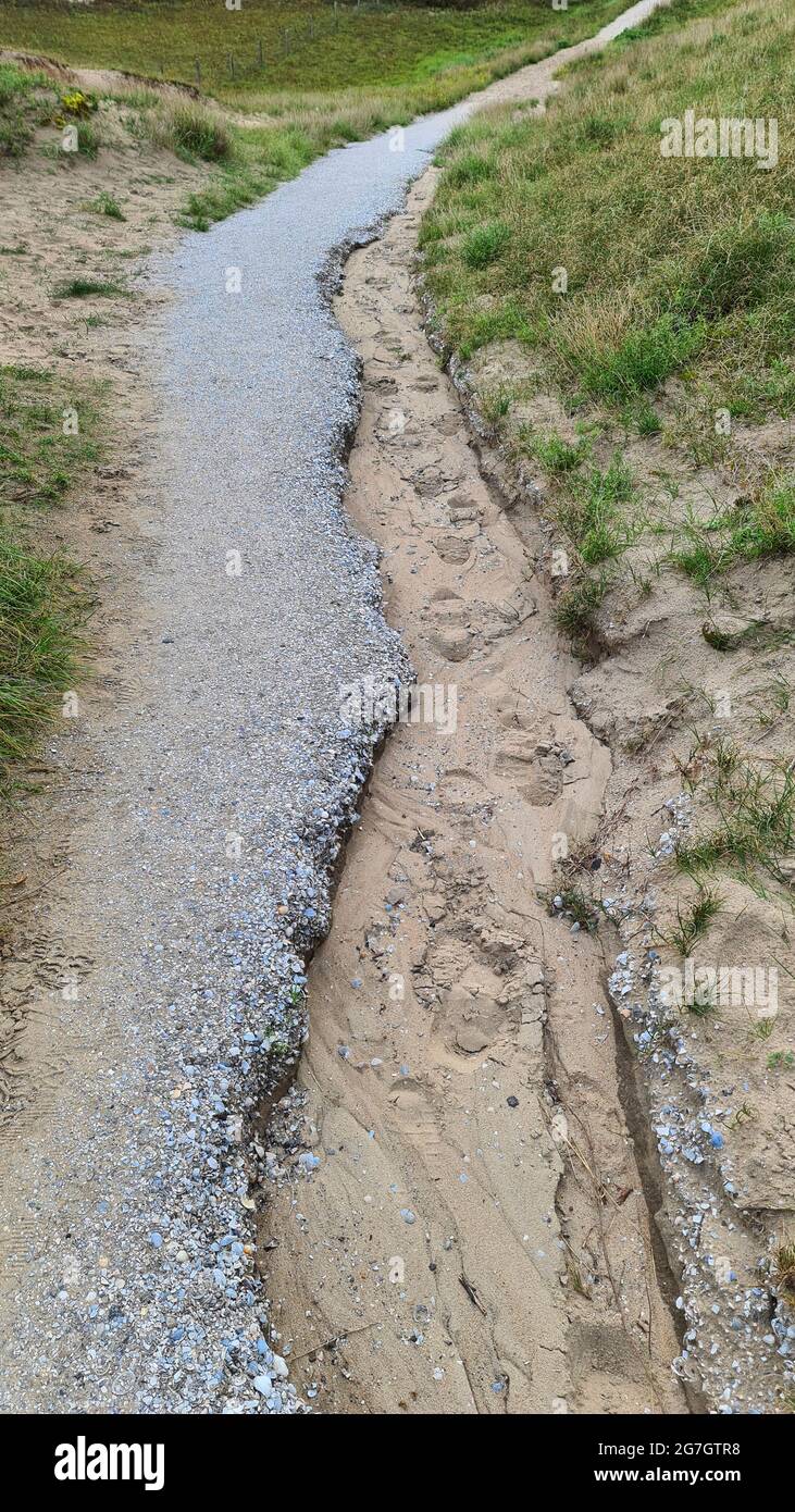 footpath partially washed away by heavy rain, Netherlands Stock Photo