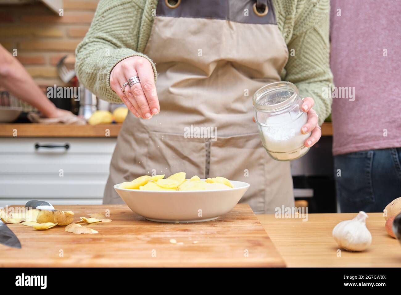 Female add salt to food hires stock photography and images Alamy