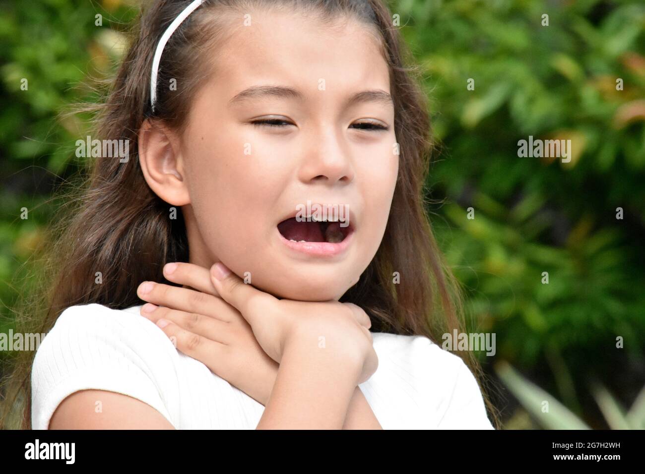 A Pretty Philippina Kids Choking Outside Stock Photo Alamy