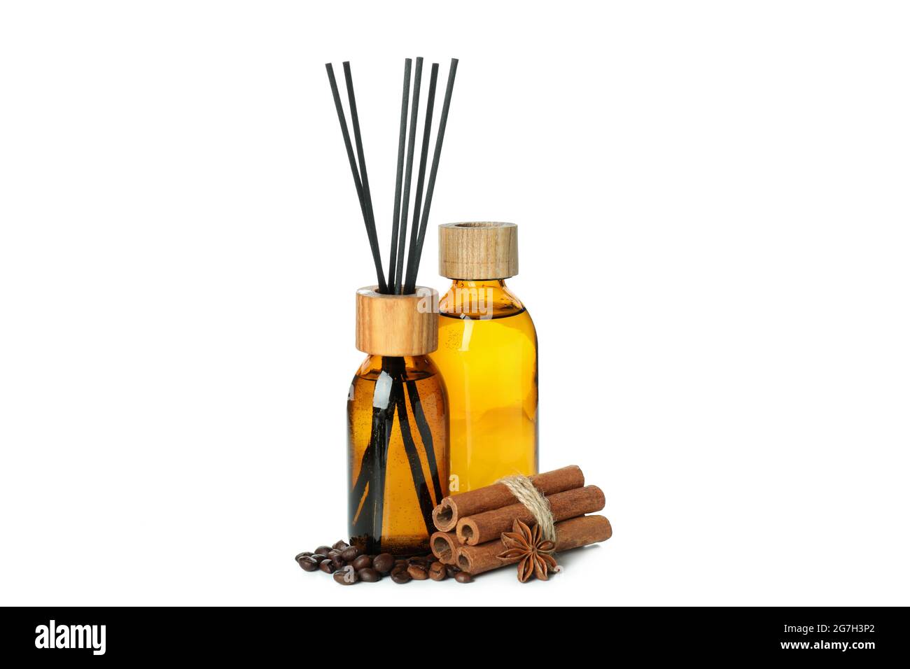 Diffusers, coffee beans and cinnamon sticks isolated on white background Stock Photo