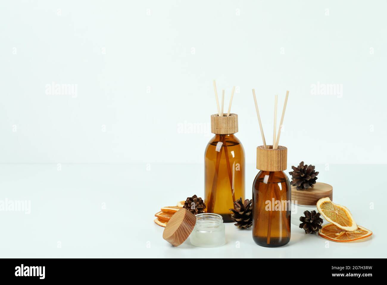 Diffusers, lemons and cones on white background Stock Photo
