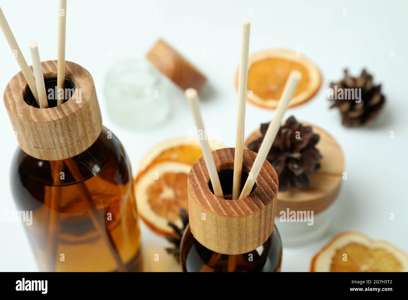 Diffusers, lemons and cones on white background Stock Photo