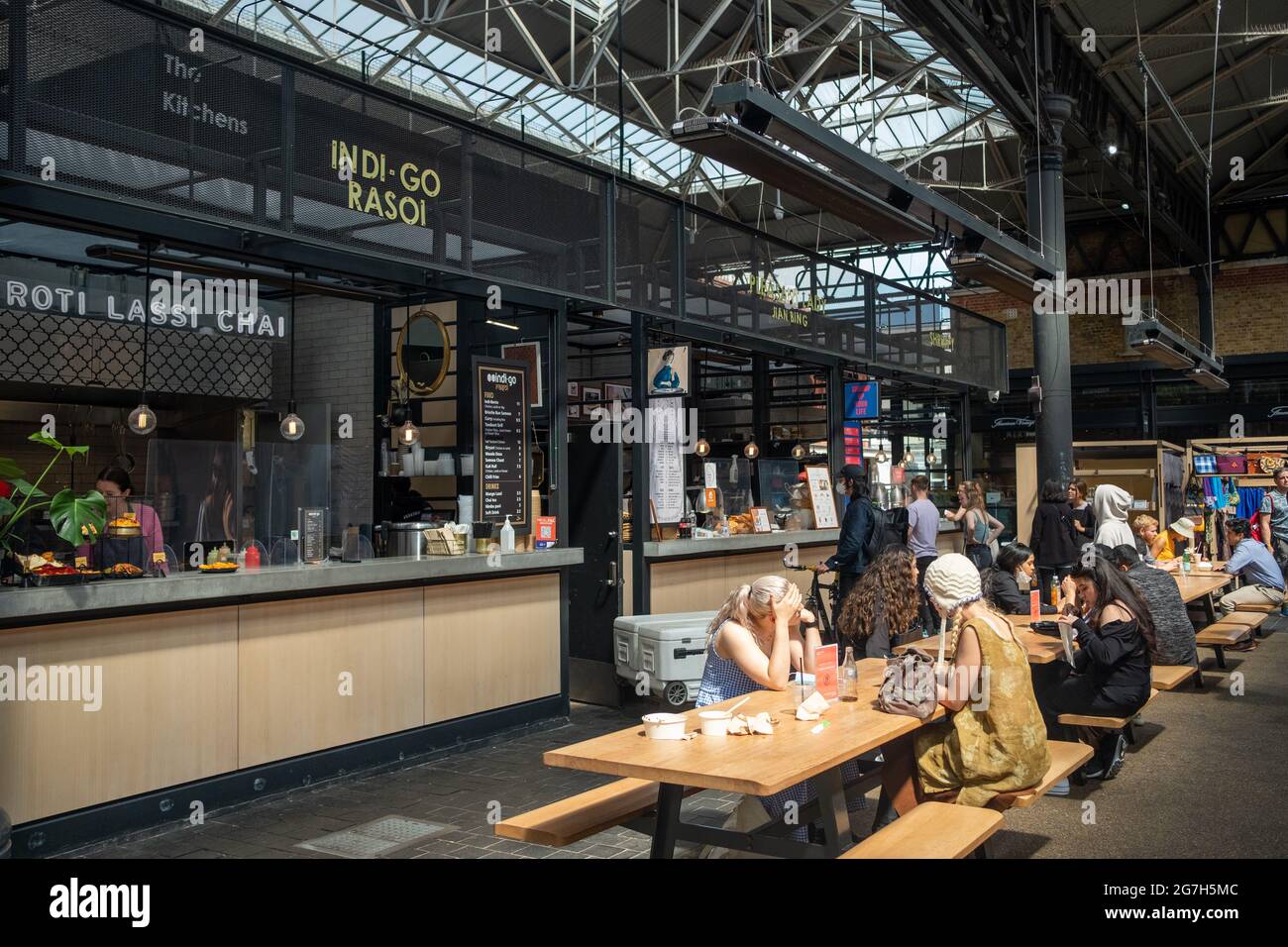 London- July, 2021: Food stalls inside Spitalfields Market.  A popular market with food, bars, arts and crafts Stock Photo