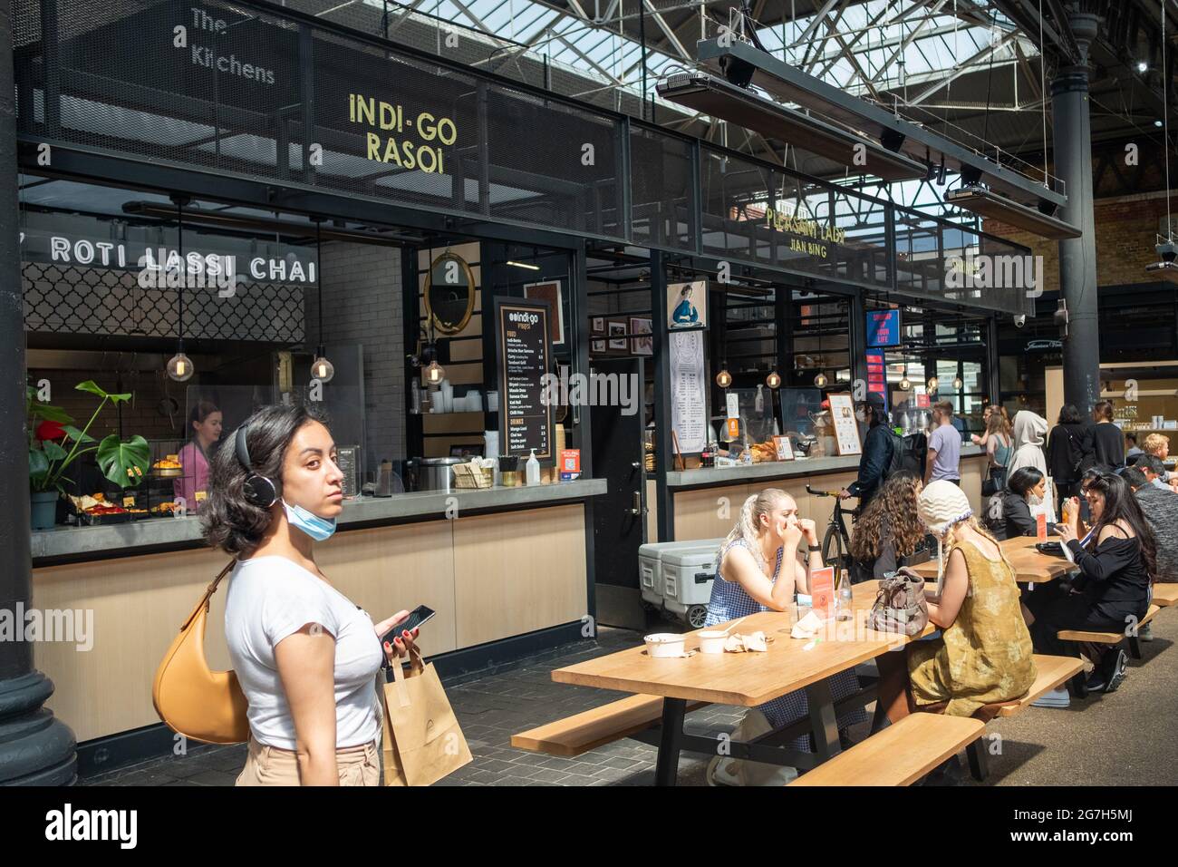London- July, 2021: Food stalls inside Spitalfields Market.  A popular market with food, bars, arts and crafts Stock Photo