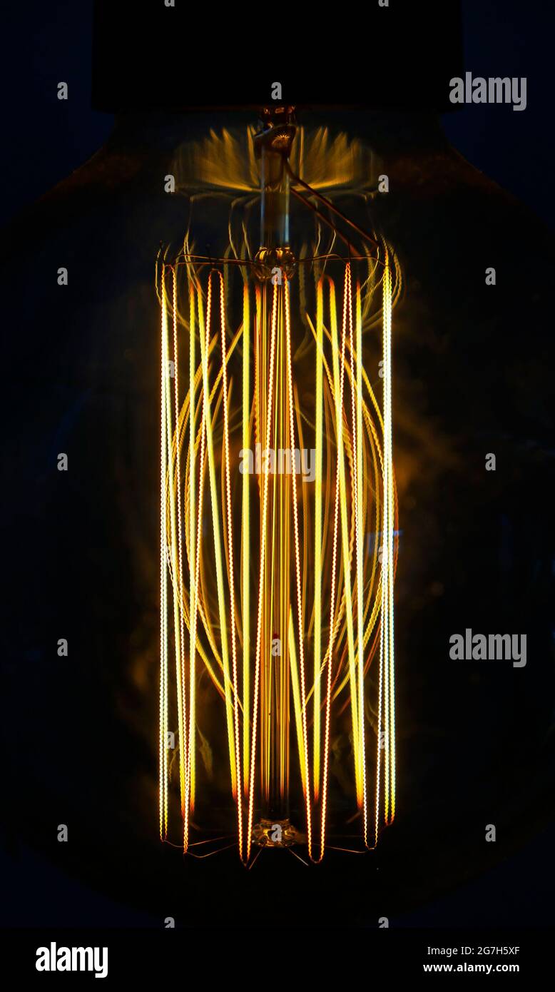 Closeup of a glowing incandescent light bulb filaments Stock Photo Alamy