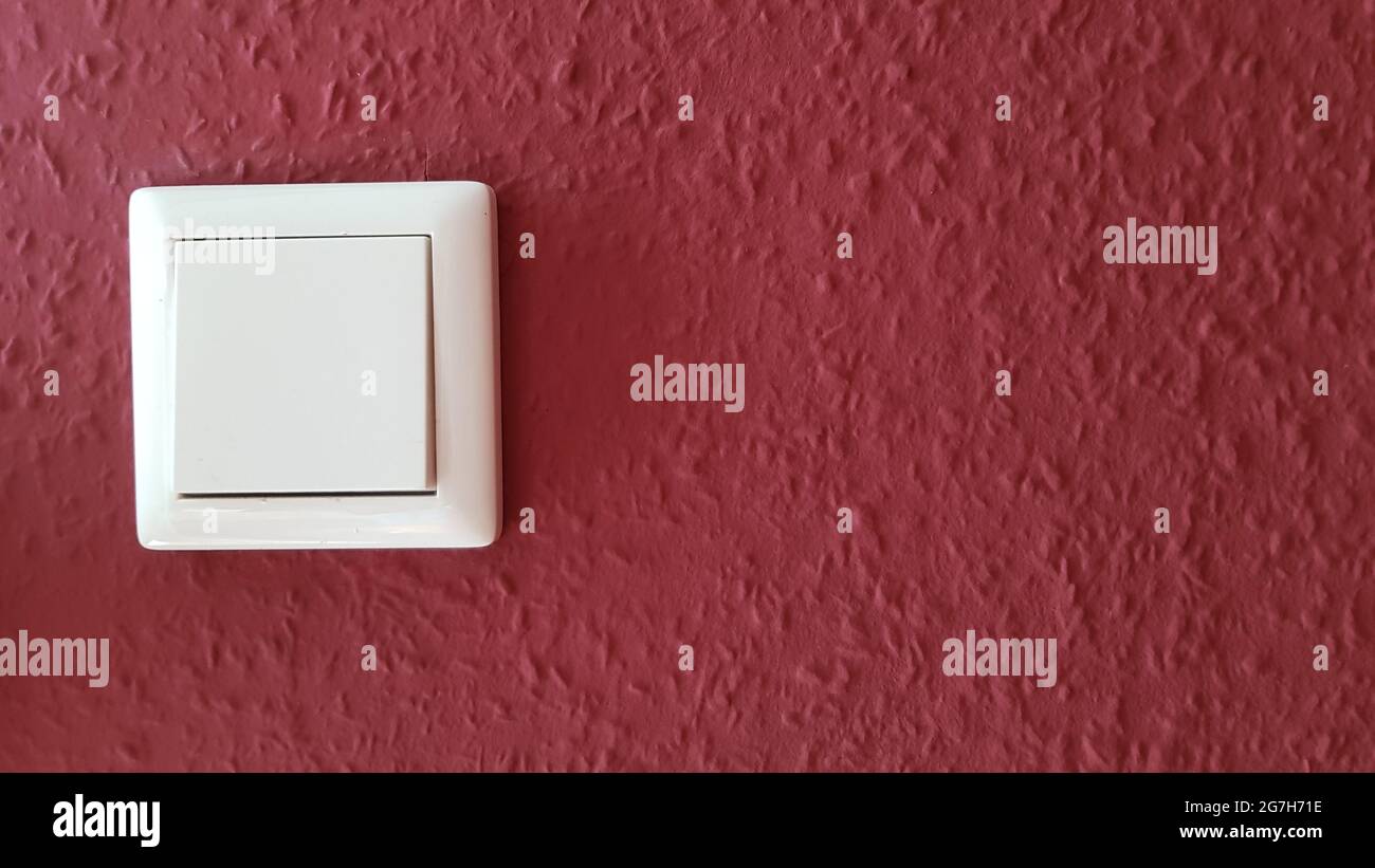 Light switch on the wall Stock Photo Alamy