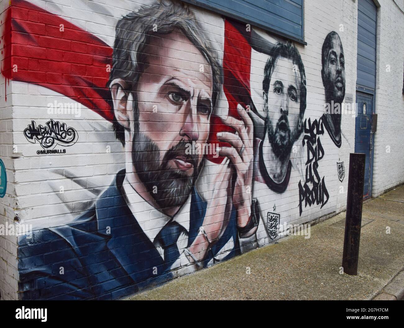London, United Kingdom. 14th July 2021. A new mural by MurWalls has been unveiled at Vinegar Yard, next to London Bridge, of England football manager Gareth Southgate and players Harry Kane and Raheem Sterling, following the team's achievement of making it to the final of Euro 2020.  (Credit: Vuk Valcic / Alamy Live News) Stock Photo