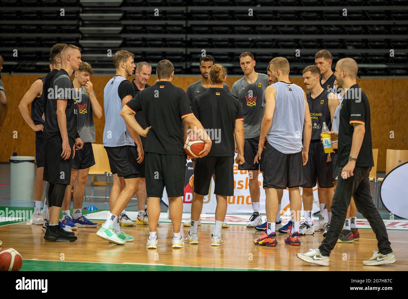 Trier, Germany. 14th July, 2021. The national basketball players stand  together during media training. The team is currently guesting in Trier in  preparation for the Olympic Games in Japan. Credit: Harald Tittel/dpa/Alamy