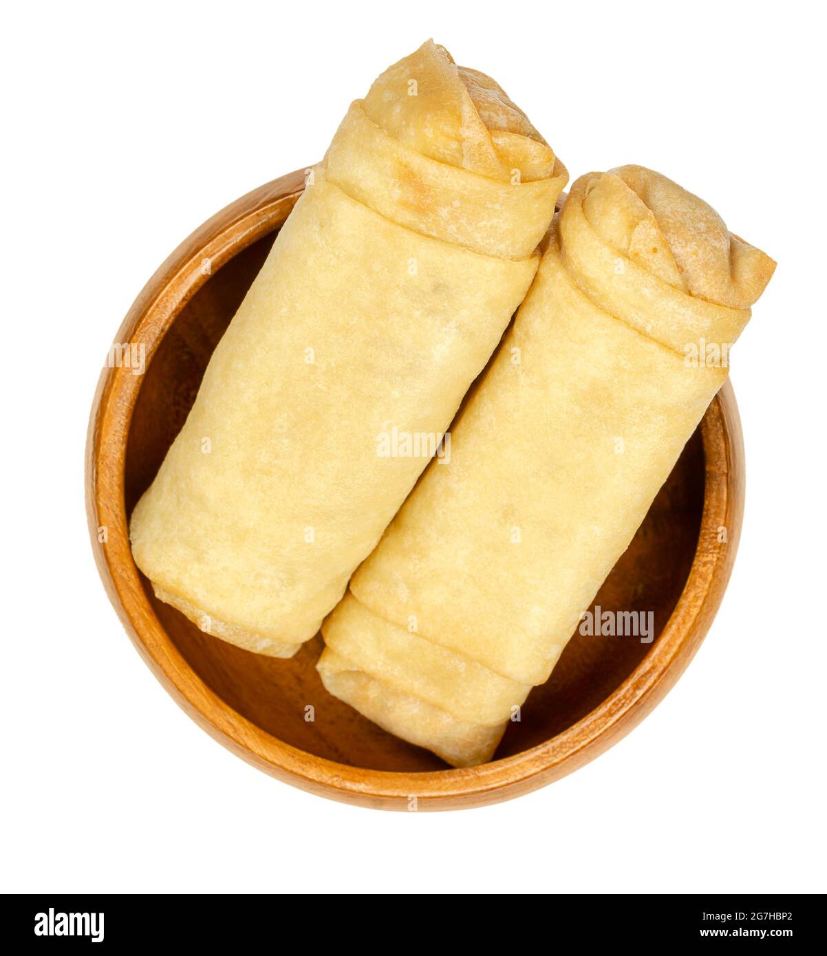 Unfried spring rolls, in a wooden bowl. Two spring rolls, ready to fry. Filled and rolled wrappers, appetizers in Asian cuisine. Close-up, from above. Stock Photo