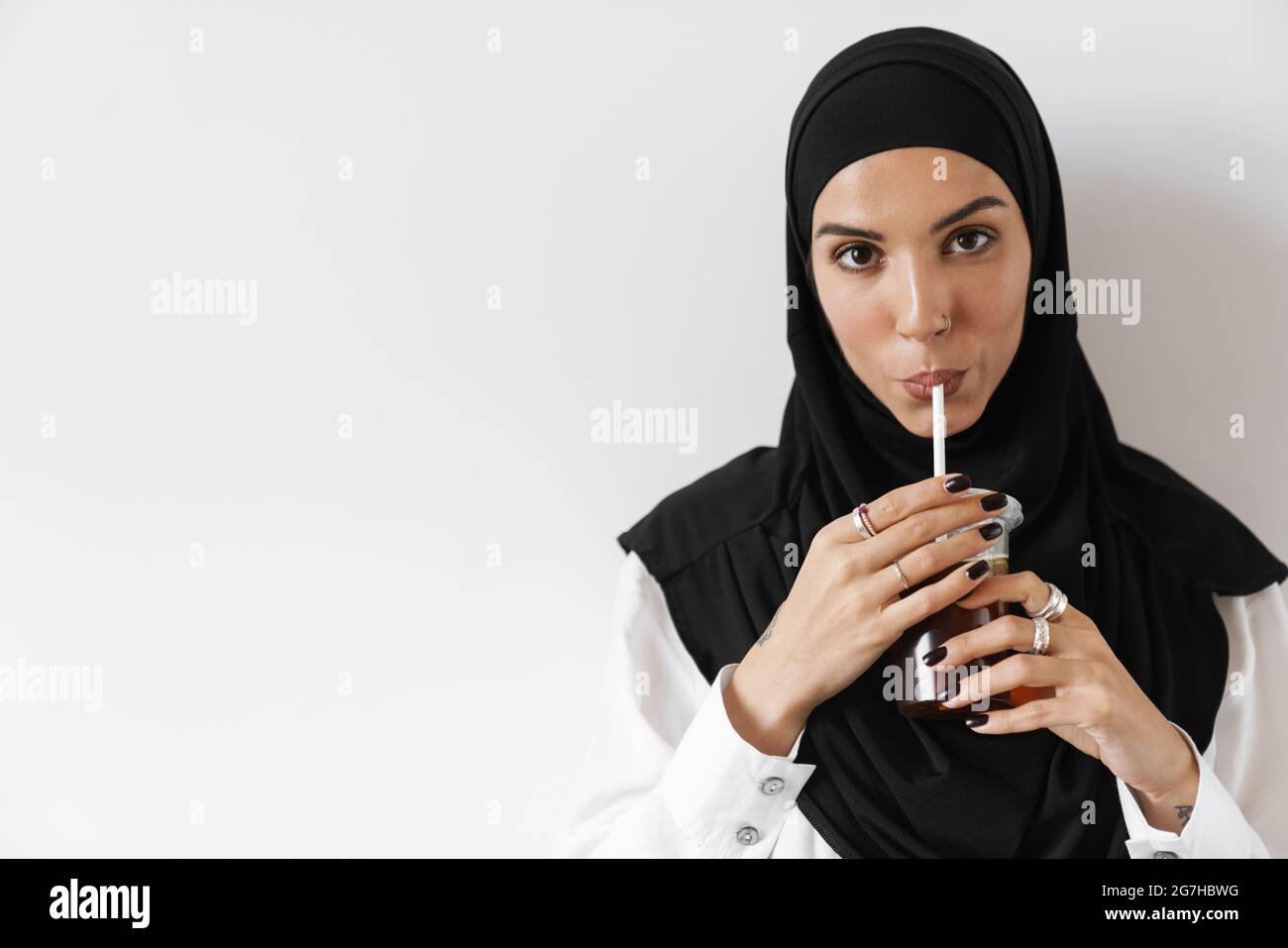 Hijab drinking hi-res stock photography and images - Alamy