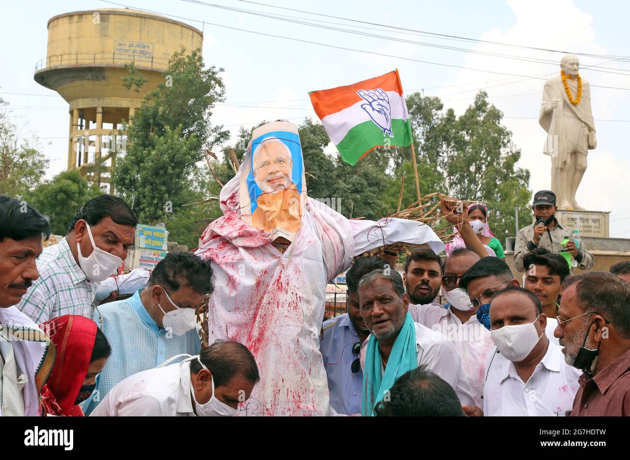 Rajasthan, India. 14th July, 2021. Congress party activists with an effigy of Indian Prime Minister Narendra Modi during protest against Central's Modi Government over high inflation and rising prices of petrol, diesel and cooking gas cylinder at Mahatma Gandhi circle in Beawar. (Photo by Sumit Saraswat/Pacific Press) Credit: Pacific Press Media Production Corp./Alamy Live News Stock Photo
