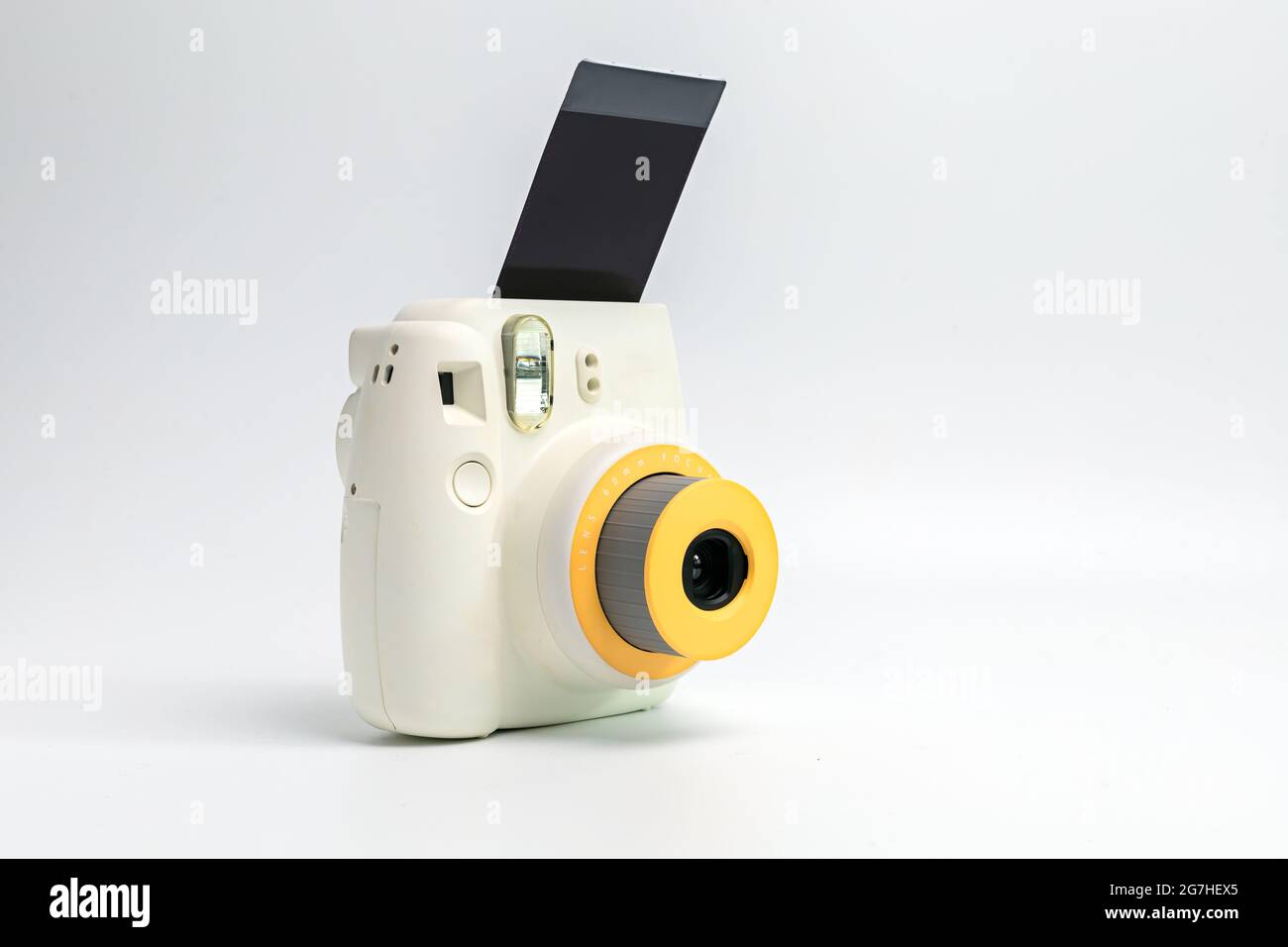 polaroid camera, film camera with photo film on white background Stock Photo