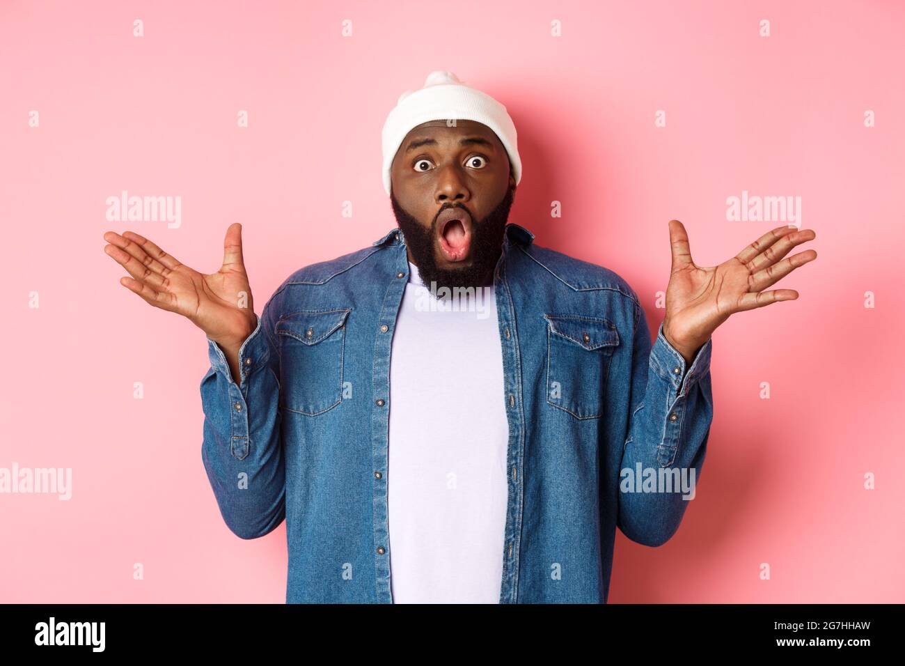 Shocked and impressed Black man staring at camera with complete 