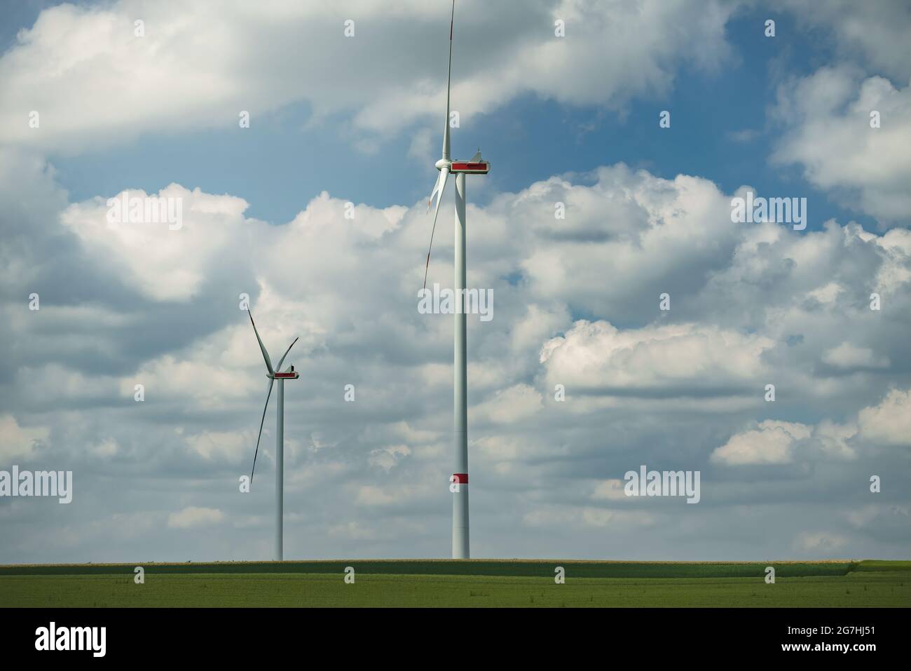 Green landscape with wind turbines during a cloudy day Stock Photo - Alamy