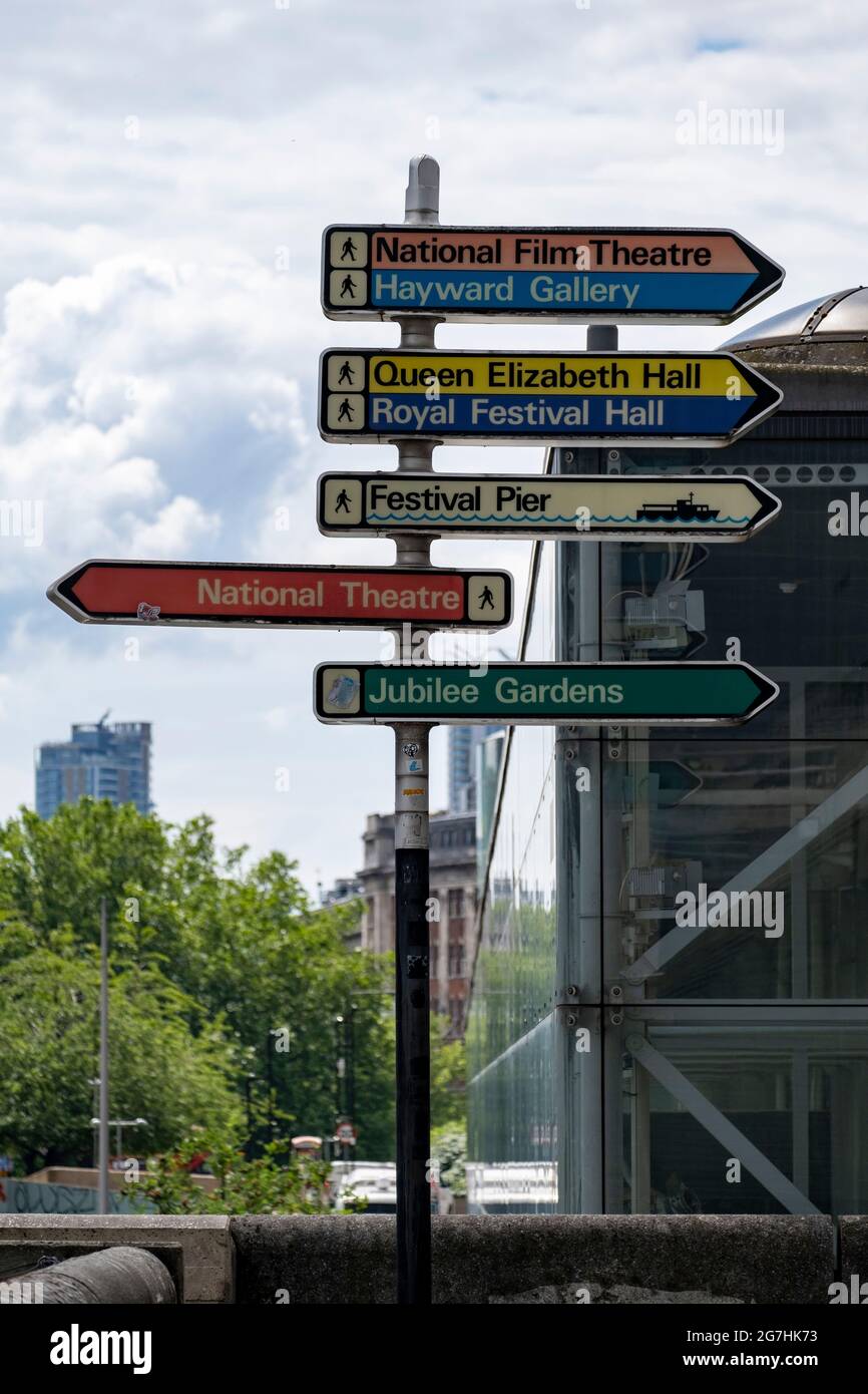 Original 1970s South Bank Centre styled signage on a crosswalk between the National Theatre and the Royal Festival Hall, nicely preserved. Stock Photo